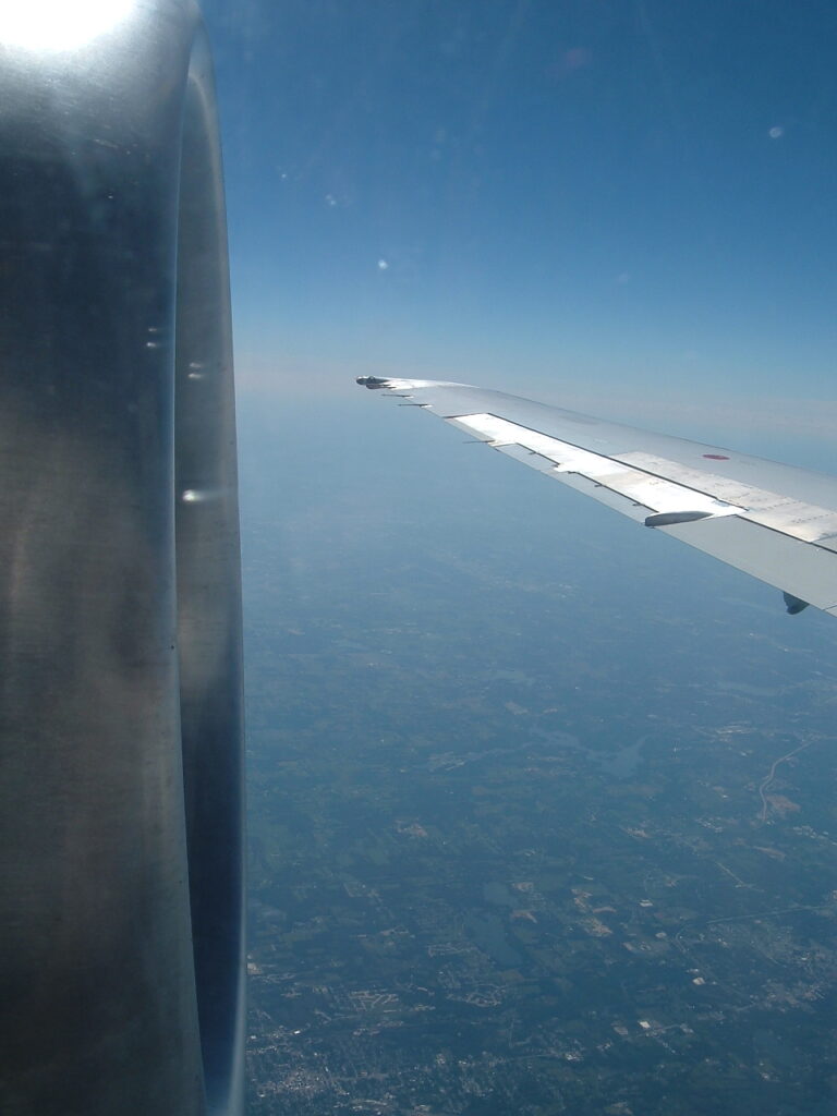 View in flight between the engine intake and aft wing aileron.