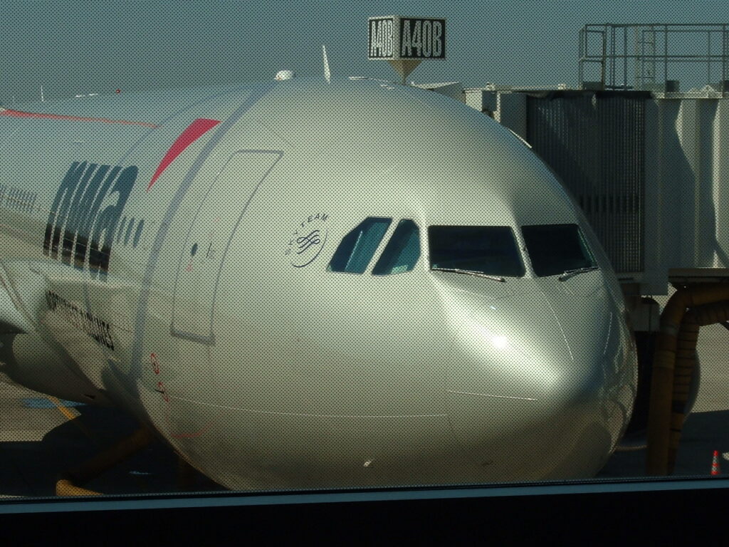 Northwest Airlines A330 Aircraft at gate DTW gate A40B. Reg. Unknown - Note how the dots on window interfered with the shot.