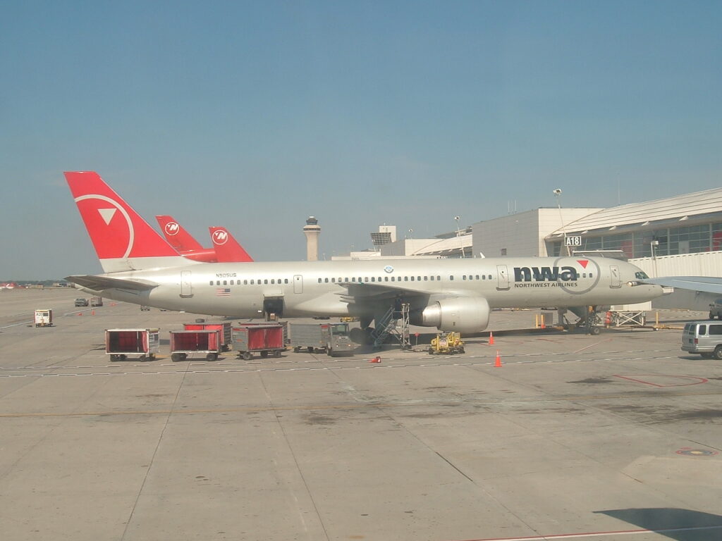 A Northwest Airlines Boeing 757-251 N505US MSN: 23194 came to NWA in May, 1985 now broken up: Sits at the gate next to ours as we wait for pushback.