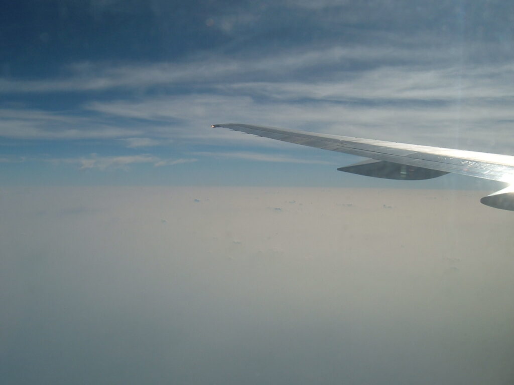 View skyward including the left (port) outer wing of the 757-251 aircraft in cruise flight.