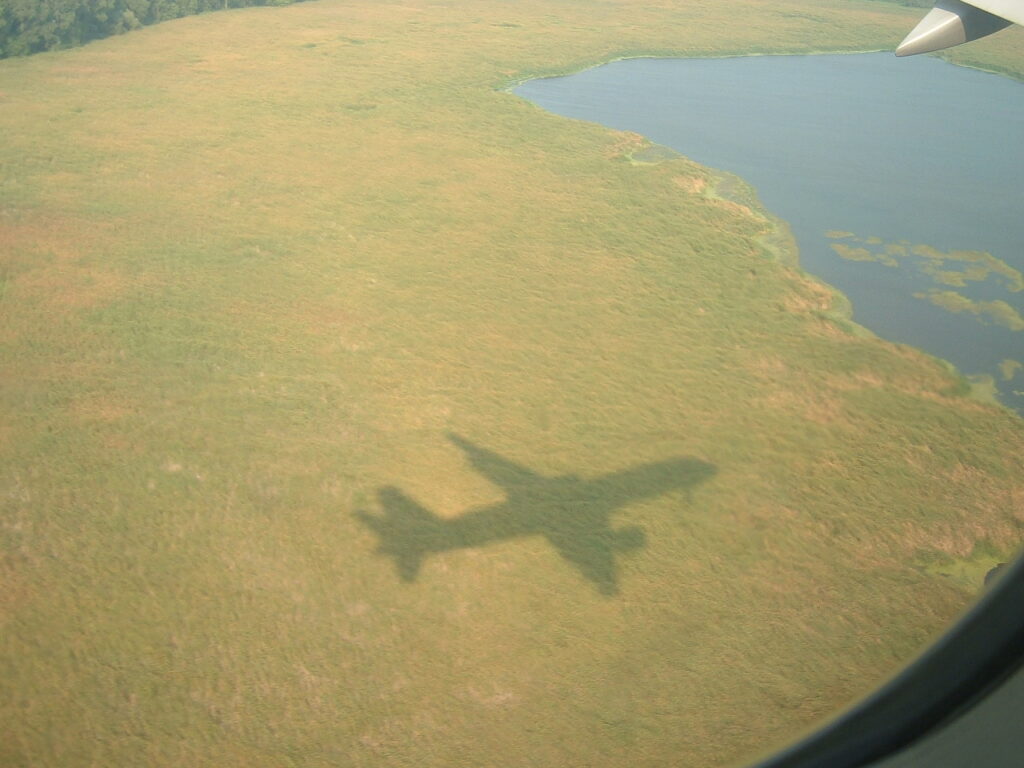 The aircraft chasing the shadow effect as we make our approach for Minneapolis-St. Paul MSP runway 12R.