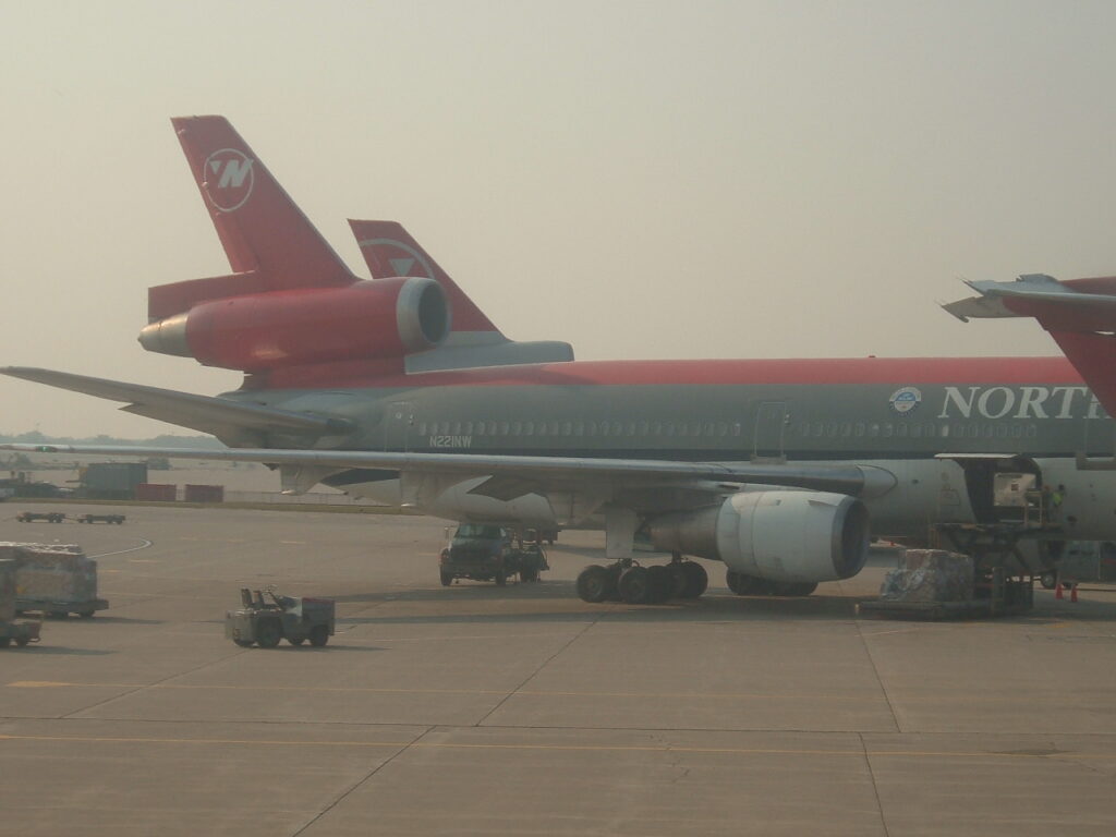 Freight loading / unloading of the 
Northwest Airlines, McDonnell Douglas DC-10-30, N221NW Seen at Minneapolis-St. Paul gate G8 in 10-Sep-2005.