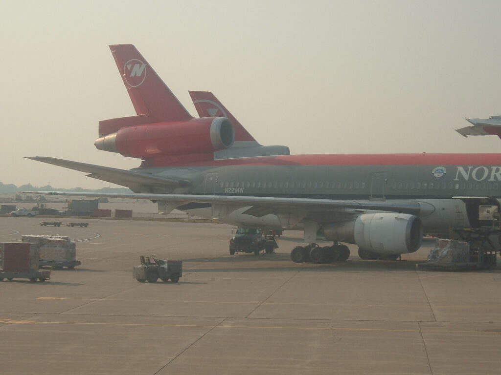 A different angle of the Freight loading / unloading of the 
Northwest Airlines, McDonnell Douglas DC-10-30, N221NW Seen at Minneapolis-St. Paul gate G8 in 10-Sep-2005.