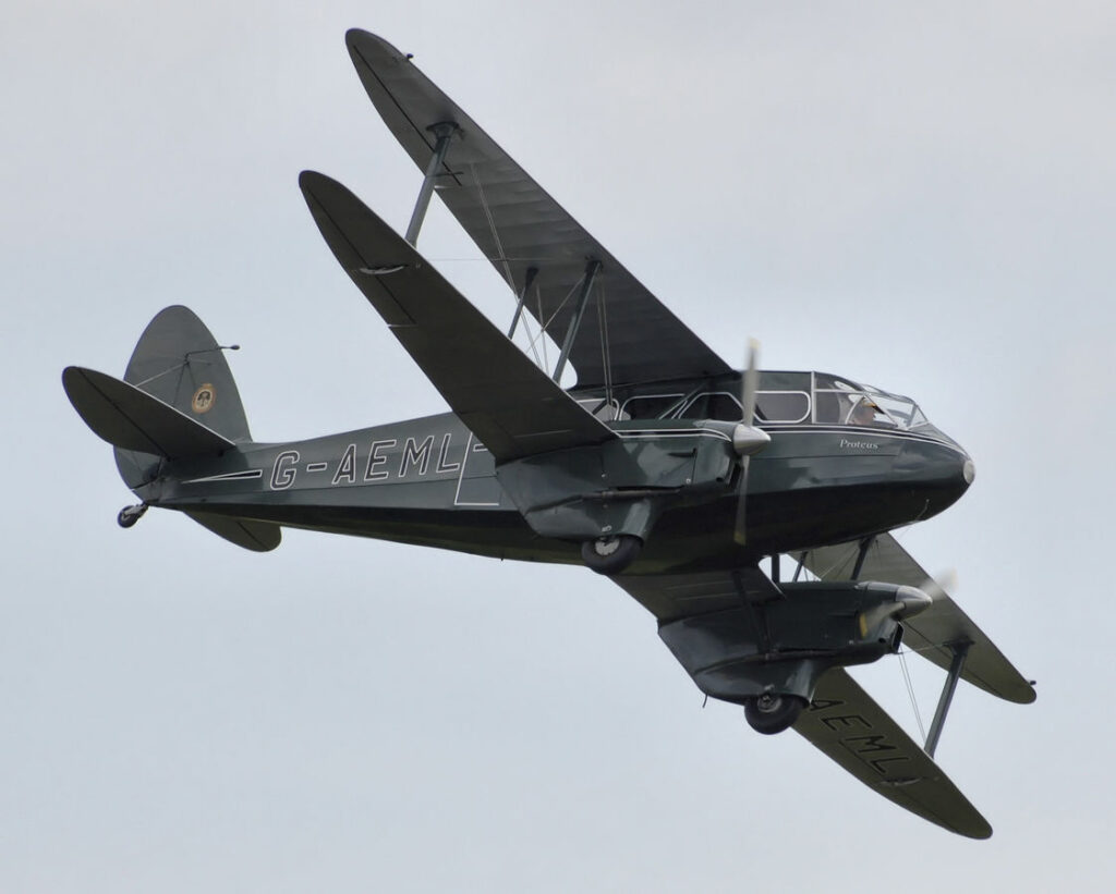 DH.89 Dragon Rapide (G-AEML) at Kemble Airport Open Day, Gloucestershire, England, 9th September 2007. Built in 1936. Photographed by Adrian Pingstone and placed in the public domain. 9 September 2007 (according to Exif data). Author: Arpingstone